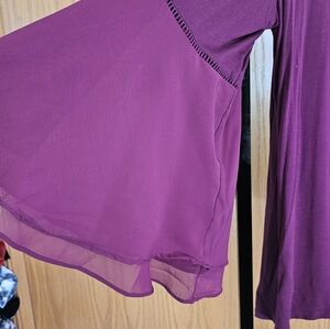 Plus size burgundy blouse.